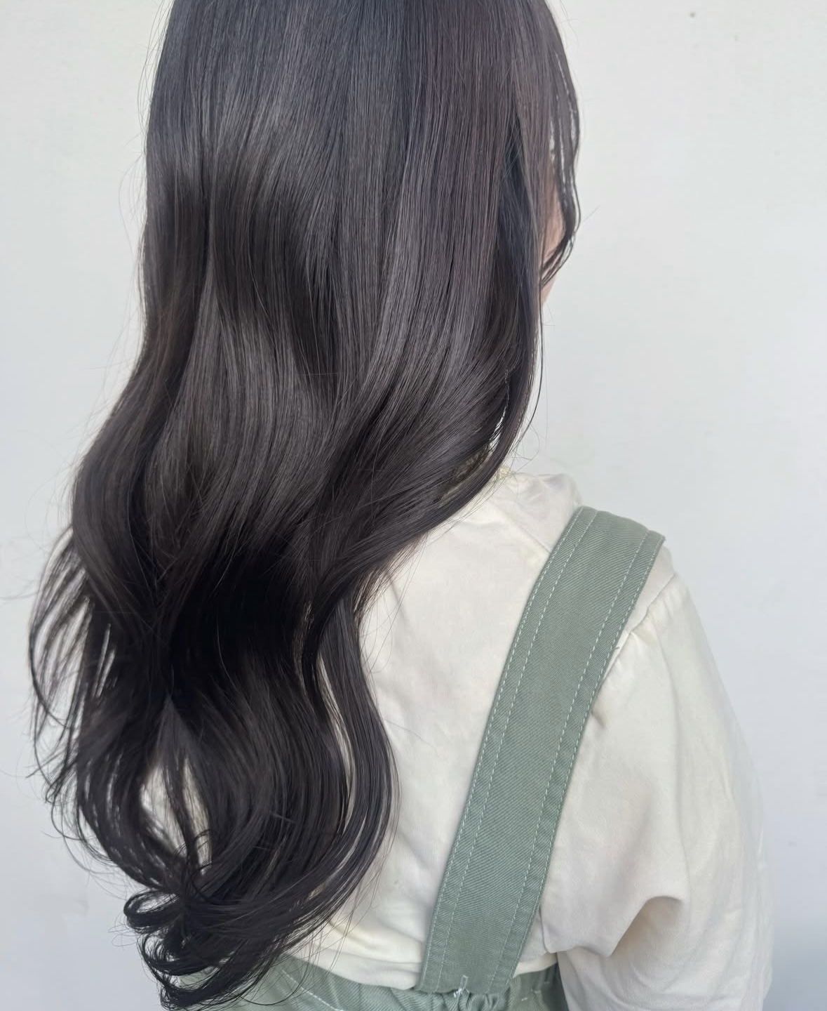 Long brown hair being styled