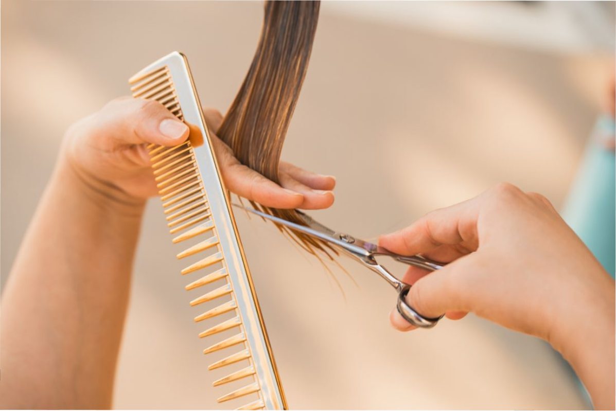 Stylist attending to a client in a bright salon